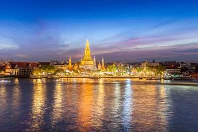 Illuminated buildings at waterfront