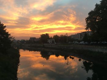 Scenic view of lake against orange sky