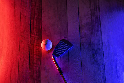 High angle view of red object on wooden wall