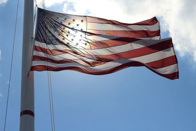 Low angle view of flag against sky