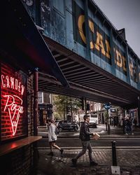 People walking on street in city