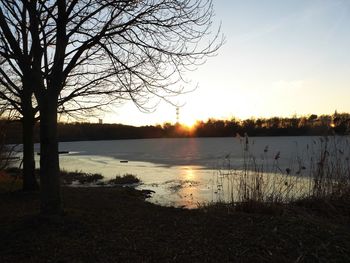 Scenic view of lake against sky during sunset