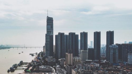 Modern buildings in city against sky