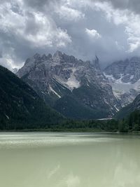 Scenic view of lake and mountains against sky