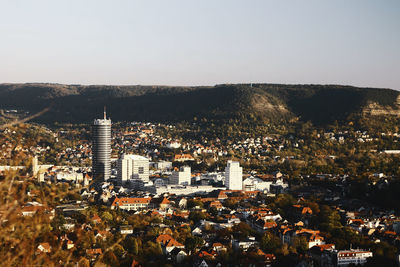 Cityscape with mountain range in background