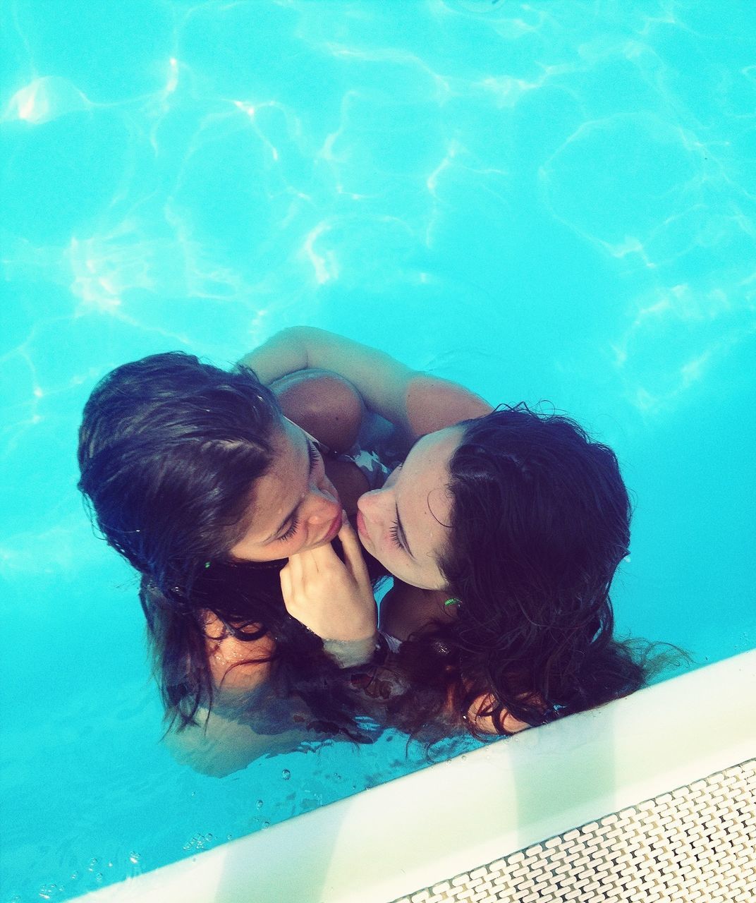 water, blue, swimming pool, lifestyles, swimming, leisure activity, sea, turquoise colored, childhood, rear view, person, full length, high angle view, shirtless, underwater, togetherness, indoors