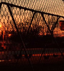 Chainlink fence at sunset