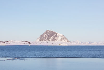 Scenic view of mountains against clear blue sky