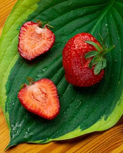 High angle view of strawberries on leaves