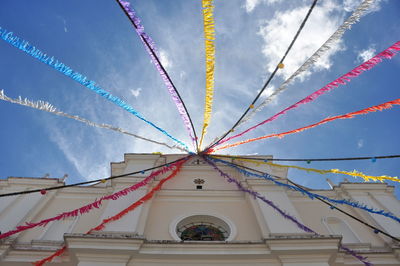 Low angle view of multi colored bridge against sky