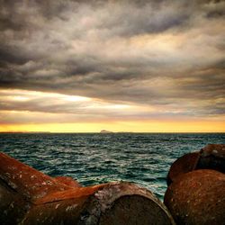 Scenic view of sea against sky during sunset