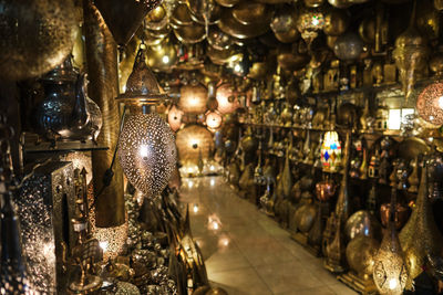 Illuminated lanterns hanging in restaurant