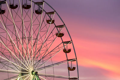 Low angle view of ferris wheel against sky