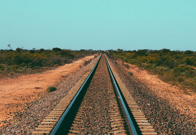 Railroad tracks against clear sky