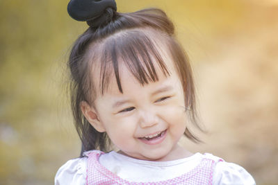 Close-up of cute girl smiling