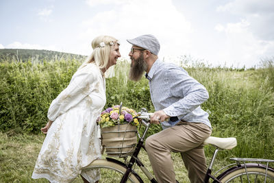 Rear view of people on field