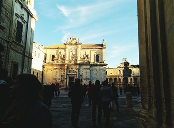 Tourists in front of building