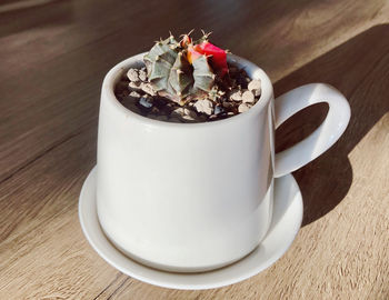 High angle view of coffee cup on table