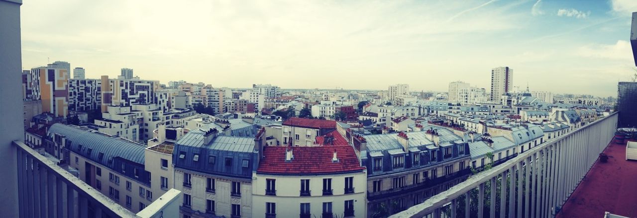 building exterior, architecture, built structure, city, cityscape, sky, crowded, residential district, high angle view, residential structure, residential building, cloud - sky, city life, roof, day, tower, cloud, outdoors, skyscraper, no people