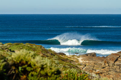 Scenic view of sea against clear sky