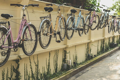 Bicycles parked by railing