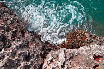 High angle view of rocks on shore