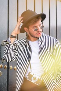Portrait of young man wearing hat