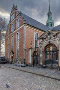 Exterior of historic building against sky in city