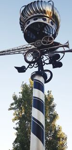 Low angle view of street light against sky