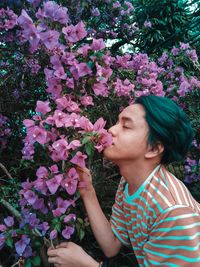 Beautiful woman with pink flower plants