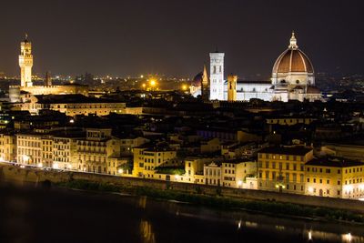 Illuminated buildings in city at night