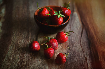 High angle view of strawberries in bowl on table