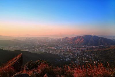 Aerial view of landscape against sky during sunset