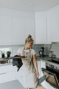 Smiling woman in kitchen