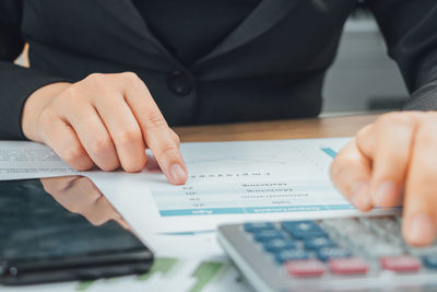 Close-up of man working on table