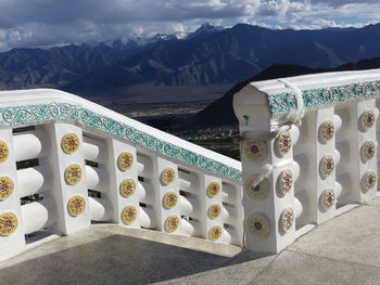 Graffiti on snowcapped mountains against sky