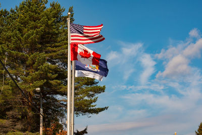 Low angle view of flag against sky