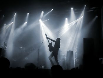 Low angle view of silhouette people at music concert