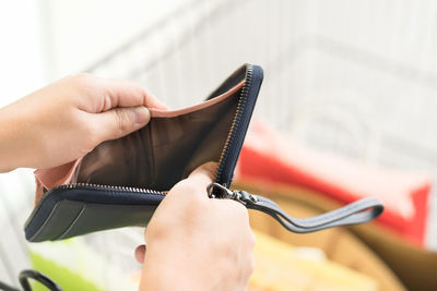 Close-up of hand holding mobile phone