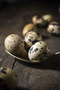 Quail eggs on a wooden table.