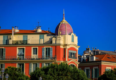 Low angle view of building against clear blue sky