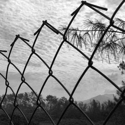 Chainlink fence against sky