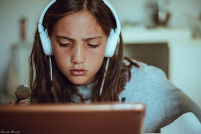 Portrait of girl looking at camera at home