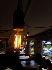 Illuminated light bulbs in restaurant