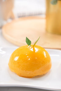 Close-up of orange slice in plate