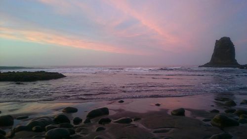 Scenic view of sea against dramatic sky