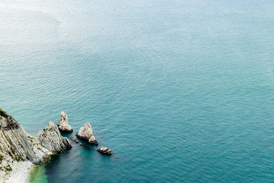 High angle view of rocks in sea