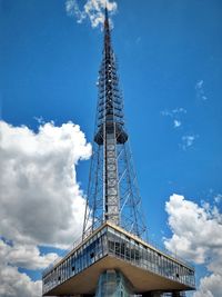 Low angle view of tower against cloudy sky