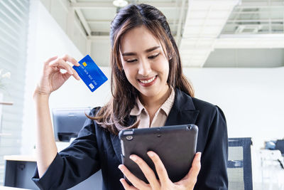 Young woman using mobile phone