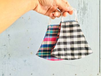 Midsection of woman holding umbrella